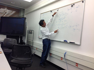 Professor Vakil teaching on whiteboard